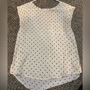 Sheer blouse with hearts and a little pocket.